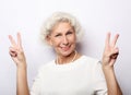 Grey haired old nice beautiful laughing woman. Isolated over vwhite background. Close up. Royalty Free Stock Photo