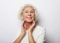 Grey haired old nice beautiful laughing woman. Isolated over vwhite background. Close up. Royalty Free Stock Photo