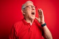 Grey haired senior man wearing glasses and casual t-shirt over red background shouting and screaming loud to side with hand on Royalty Free Stock Photo
