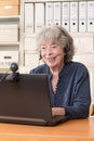 Grey haired woman video chat Royalty Free Stock Photo