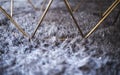 Grey carpet with long hairs and design table. Interior style.