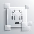 Grey Headphones with microphone icon isolated on grey background. Square glass panels. Vector