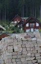 Grey Hewn Stones Pallet With Red Timber Cottages On Background Royalty Free Stock Photo