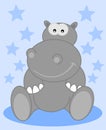 A grey hippo sitting smiling for child Royalty Free Stock Photo