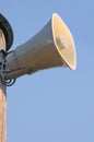 Grey horn loudspeaker on the pole over blue sky Royalty Free Stock Photo