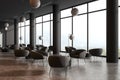 Grey hotel interior lobby with armchairs and coffee table, window Royalty Free Stock Photo