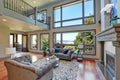 Grey interior of high vaulted ceiling family room. Royalty Free Stock Photo