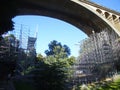 A grey iron skeleton below a high bridge in Luxembourg.