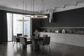 Grey kitchen interior with eating table and seats, kitchenware and window Royalty Free Stock Photo