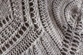 Grey knitted carpet closeup. Textile texture off white background. Detailed warm yarn background. Knit cashmere beige Royalty Free Stock Photo