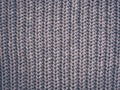 Grey knitted texture, dark fabric background. Vinrage color , trends fashion. Woolen sweater, backdrop clothing Royalty Free Stock Photo