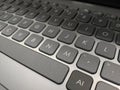 Grey laptop keyboard with AI key