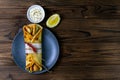 Grey late with delicious kebab rolls on wooden table. Top views with clear space