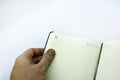 Grey leather notebook on a white background. Notebook close-up. An open notebook Royalty Free Stock Photo