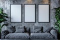 Grey living room with couch and set of three empty frames for wall art mock up. Modern loft interior. Royalty Free Stock Photo