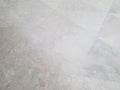 Grey marble or granite triangle stone tiles on ground