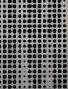 Grey metal cladding with circular holes design Royalty Free Stock Photo