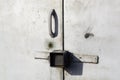 Grey metal garage door with padlocks handle Royalty Free Stock Photo