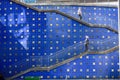 Grey metal staircase against a blue wall in Stockholm, Hammarby