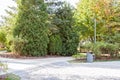 grey minimalist garbage can with mulched landscape in the park Royalty Free Stock Photo