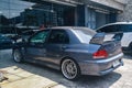 Grey Mitsubishi Lancer evolution VII GT-A CT9A on car workshop parking lot Royalty Free Stock Photo