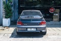 Grey Mitsubishi Lancer evolution VII GT-A CT9A on car workshop parking lot Royalty Free Stock Photo