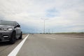 Grey modern car parked on asphalt road Royalty Free Stock Photo