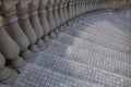 Grey mosaic stairs with marble column. Urban architecture background. Building detail. Royalty Free Stock Photo