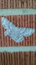 Grey moth on brick