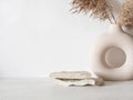 Grey natural stones podium on white background, platform for product display