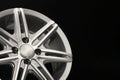 grey new alloy wheel for car, side view close-up, polished. copyspace