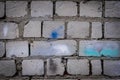 Grey, old brick stone wall texture background. Moody backdrop for design. Dark, weathered, aged, damaged blocks and stucco Royalty Free Stock Photo