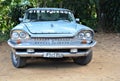 Grey, old classic american car in the parking lot near to the El Nicho waterfall