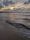 Grey orange sunset in mud beach