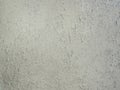 Grey paint peeling on a metallic surface background. Old grungy, weathered painted wall texture. Cracked, dirty, silver plaster Royalty Free Stock Photo