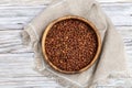 Grey peas in round rustic bowl on wooden table. Traditional Latvian food, Legumes bean seed, banner