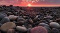 grey pebbles on beach at sunset with pink glow grom sunset on some of the pebbles