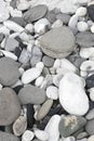 Grey pebbles and rocks in a beach