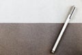 Grey pen on the black and gray papers background and texture Royalty Free Stock Photo