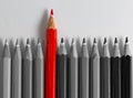 Grey pencil in order with one red standing out Royalty Free Stock Photo