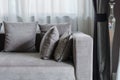 Grey pillows on modern sofa in living room