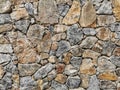 Grey and pink coloured stone-built wall abstract background