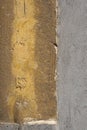 Grey plaster, grunge,rough, hoarse old wall with painted part