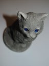 Grey plaster statuette of a cat