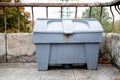 Grey plastic box for sand or salt storage for janitor and communal service