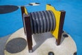 Grey plastic pipe on yellow wooden supports for children to play and climb. Playgrounds, toys