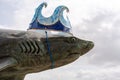 The Grey Reef Shark sculpture at The Deep, Kingston upon Hull, UK, wearing a crown of waves