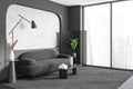 Grey relaxing room interior with couch and coffee table, panoramic window