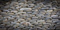 Grey river pebbles round stone wall background Royalty Free Stock Photo