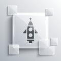 Grey Rocket ship icon isolated on grey background. Space travel. Square glass panels. Vector